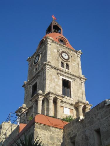 The clock tower of the medieval town of Rhodes, part of city tour